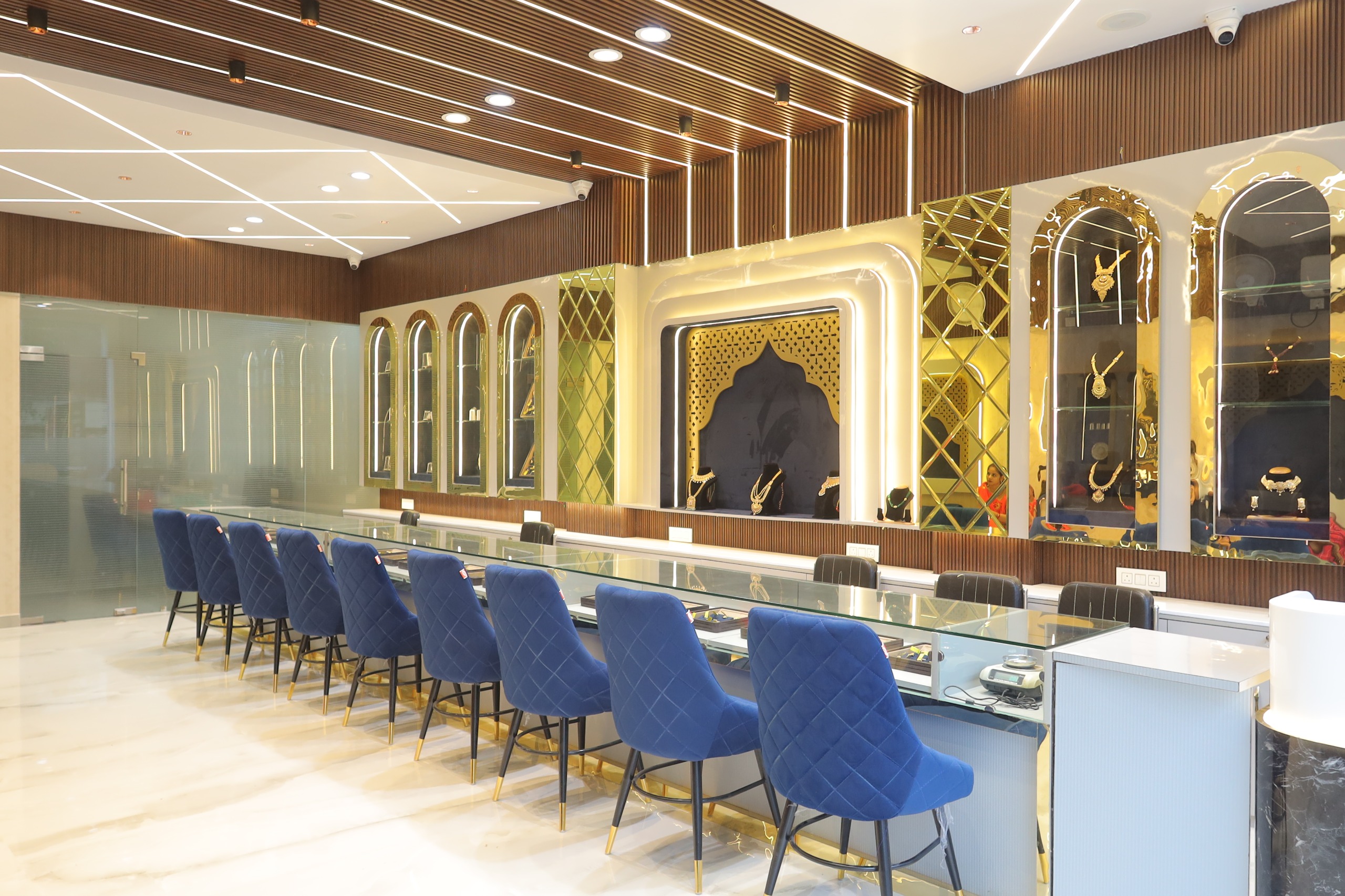 Shri Kasturi Jewellers main display hall with gold arched niches